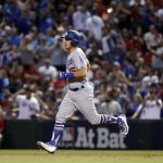 Los Angeles Dodgers' Austin Barnes (15) rounds the bases after hitting a solo home run during the sixth inning of game 3 of baseball's National League Division Series against the Arizona Diamondbacks, Monday, Oct. 9, 2017, in Phoenix. (AP Photo/Rick Scuteri)