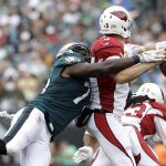 Philadelphia Eagles' Vinny Curry, left, tackles Arizona Cardinals' Carson Palmer during the first half of an NFL football game, Sunday, Oct. 8, 2017, in Philadelphia. (AP Photo/Michael Perez)