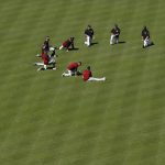 Arizona Diamondbacks players stretch out during practice at Chase Field as the team gets ready for a National League wild card playoff baseball game Monday, Oct. 2, 2017, in Phoenix. The Diamondbacks host the Colorado Rockies on Wednesday. (AP Photo/Ross D. Franklin)