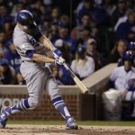 Los Angeles Dodgers' Enrique Hernandez (14) hits a home run off Chicago Cubs starting pitcher Jose Quintana during the second inning of Game 5 of baseball's National League Championship Series, Thursday, Oct. 19, 2017, in Chicago. (AP Photo/Matt Slocum)