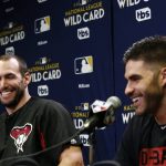 Arizona Diamondbacks first baseman Paul Goldschmidt, left, and right fielder J.D. Martinez laugh at a question during a news conference at Chase Field as the team gets ready for a National League wild-card playoff baseball game Tuesday, Oct. 3, 2017, in Phoenix. The Diamondbacks face the Colorado Rockies on Wednesday. (AP Photo/Ross D. Franklin)