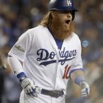 Los Angeles Dodgers' Justin Turner celebrates his three-run home run during the first inning of Game 1 of the baseball team's National League Division Series against the Arizona Diamondbacks in Los Angeles, Friday, Oct. 6, 2017. (AP Photo/Jae C. Hong)