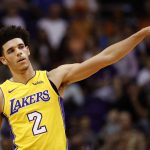 Los Angeles Lakers guard Lonzo Ball gestures to teammates during the first half of an NBA basketball game against the Phoenix Suns, Friday, Oct. 20, 2017, in Phoenix. (AP Photo/Matt York)