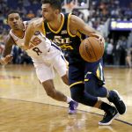 Utah Jazz guard Raul Neto (25) drives as Phoenix Suns guard Tyler Ulis (8) defends during the first half of an NBA basketball game, Wednesday, Oct. 25, 2017, in Phoenix. (AP Photo/Matt York)