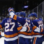 New York Islanders center John Tavares (91) celebrates with teammates after scoring a goal during the second period of an NHL hockey game against the Arizona Coyotes Tuesday, Oct. 24, 2017, in New York. (AP Photo/Frank Franklin II)