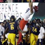 Arizona wide receiver Tony Ellison (9) makes a catch between California cornerback Camryn Bynum (24) and safety Jaylinn Hawkins (6) during the second half of an NCAA college football game Saturday, Oct. 21, 2017, in Berkeley, Calif. Arizona won 45-44 in two overtimes. (AP Photo/Marcio Jose Sanchez)