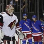 New York Rangers' Michael Grabner (40) celebrates with teammates Boo Nieves (24) and Pavel Buchnevich (89) after scoring a goal during the second period of an NHL hockey game as Arizona Coyotes goalie Adin Hill (31) reacts Thursday, Oct. 26, 2017, in New York. (AP Photo/Frank Franklin II)