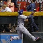 Los Angeles Dodgers right fielder Yasiel Puig (66) can't catch a home run hit by Arizona Diamondbacks Daniel Descalso during the fifth inning of game 3 of baseball's National League Division Series, Monday, Oct. 9, 2017, in Phoenix. (AP Photo/Ross D. Franklin)