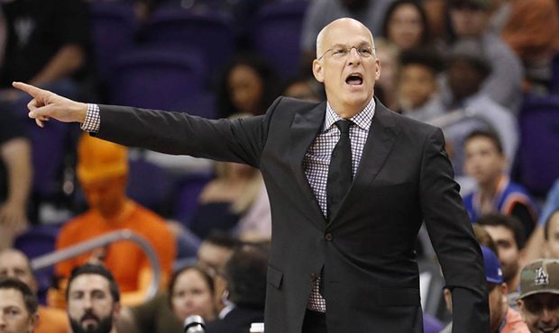 Phoenix Suns head coach Jay Triano yells during the first half of an NBA basketball game against th...