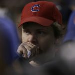 A Chicago Cubs fan watches during the sixth inning of Game 5 of baseball's National League Championship Series against the Los Angeles Dodgers, Thursday, Oct. 19, 2017, in Chicago. (AP Photo/Nam Y. Huh)