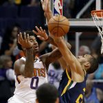 Phoenix Suns forward Marquese Chriss (0) has his shot blocked by Utah Jazz center Rudy Gobert during the first half of an NBA basketball game, Wednesday, Oct. 25, 2017, in Phoenix. (AP Photo/Matt York)