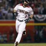 Arizona Diamondbacks' Daniel Descalso (3) rounds the bases after hitting a solo home against the Los Angeles Dodgers during the fifth inning of game 3 of baseball's National League Division Series, Monday, Oct. 9, 2017, in Phoenix. (AP Photo/Rick Scuteri)