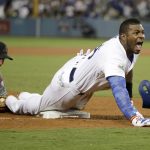 Los Angeles Dodgers' Yasiel Puig celebrates after his triple against the Arizona Diamondbacks during the seventh inning of Game 1 of a baseball National League Division Series in Los Angeles, Friday, Oct. 6, 2017. (AP Photo/Jae C. Hong)