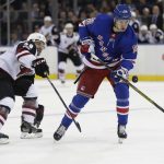 New York Rangers' Pavel Buchnevich (89) and Arizona Coyotes' Jordan Martinook (48) fights for control of the puck during the second period of an NHL hockey game Thursday, Oct. 26, 2017, in New York. (AP Photo/Frank Franklin II)