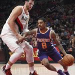 Phoenix Suns guard Tyler Ulis tries to drive past Portland Trail Blazers center Jusuf Nurkic during the second half of an NBA basketball preseason game in Portland, Ore., Tuesday, Oct. 3, 2017. The Suns won 114-112. (AP Photo/Steve Dykes)