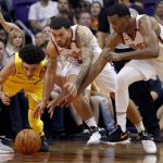 Los Angeles Lakers guard Lonzo Ball, left, loses the ball as Phoenix Suns guard Mike James, center, and forward TJ Warren defend during the second half of an NBA basketball game, Friday, Oct. 20, 2017, in Phoenix. (AP Photo/Matt York)