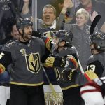Vegas Golden Knights defenseman Deryk Engelland, left, celebrates after scoring against the Arizona Coyotes during the first period of an NHL hockey game Tuesday, Oct. 10, 2017, in Las Vegas. (AP Photo/John Locher)