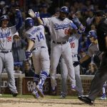 Los Angeles Dodgers' Enrique Hernandez (14) celebrates after hitting a grand slam during the third inning of Game 5 of baseball's National League Championship Series against the Chicago Cubs, Thursday, Oct. 19, 2017, in Chicago. (AP Photo/Nam Y. Huh)