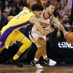 Phoenix Suns guard Mike James steals the ball from Los Angeles Lakers guard Lonzo Ball (2) during the second half of an NBA basketball game, Friday, Oct. 20, 2017, in Phoenix. (AP Photo/Matt York)