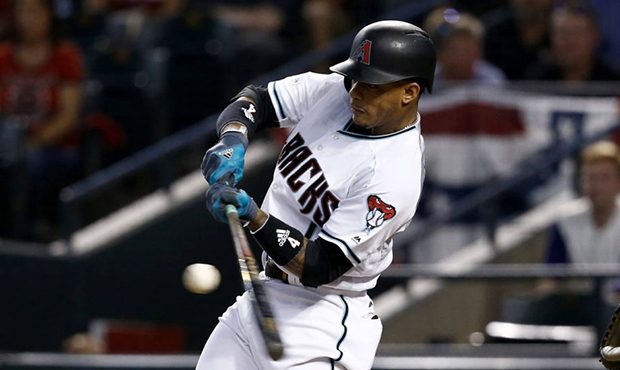 Arizona Diamondbacks' Ketel Marte connects for a base hit against the Colorado Rockies during the f...