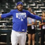 Los Angeles Dodgers right fielder Yasiel Puig warms up prior to game 3 of baseball's National League Division Series against the Arizona Diamondbacks, Monday, Oct. 9, 2017, in Phoenix. (AP Photo/Rick Scuteri)