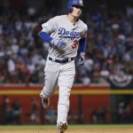 Los Angeles Dodgers' Cody Bellinger rounds the bases after hitting a solo home run during the fifth inning of game 3 of baseball's National League Division Series against the Arizona Diamondbacks, Monday, Oct. 9, 2017, in Phoenix. (AP Photo/Rick Scuteri)