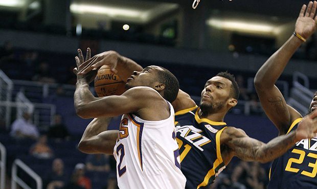 Phoenix Suns guard Elijah Millsap, left, has his shot blocked by Utah Jazz forward Joel Bolomboy (2...