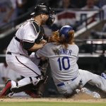 Los Angeles Dodgers' Justin Turner (10) is tagged out by Arizona Diamondbacks catcher Chris Iannetta during the ninth inning of game 3 of baseball's National League Division Series, Monday, Oct. 9, 2017, in Phoenix. (AP Photo/Rick Scuteri)