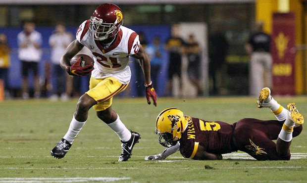 Southern California wide receiver Tyler Vaughns (21) eludes the tackle of Arizona State defensive b...