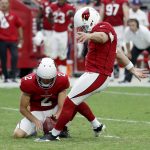 Arizona Cardinals kicker Phil Dawson (4) kicks a field goal as punter Andy Lee (2) holds against the San Francisco 49ers during the second half of an NFL football game, Sunday, Oct. 1, 2017, in Glendale, Ariz. (AP Photo/Rick Scuteri)