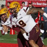 Arizona State's Jay Jay Wilson (9) celebrates after scoring on an interception with teammate Chase Lucas, left, as Utah quarterback Tyler Huntley, left, looks on in the second half of an NCAA college football game, Saturday, Oct. 21, 2017, in Salt Lake City. (AP Photo/Rick Bowmer)