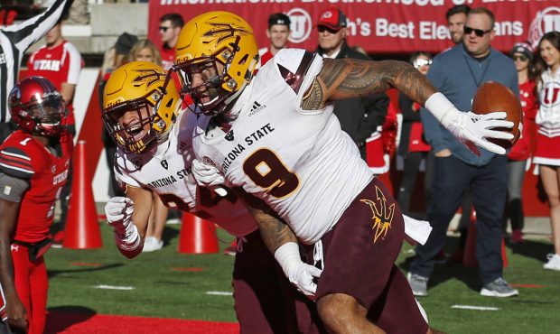 Arizona State's Jay Jay Wilson (9) celebrates after scoring on an interception with teammate Chase ...