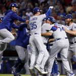 The Los Angeles Dodgers celebrate after game 3 of baseball's National League Division Series against the Arizona Diamondbacks, Monday, Oct. 9, 2017, in Phoenix. The Dodgers won 3-1 to advance to the National League Championship Series. (AP Photo/Rick Scuteri)