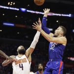 Los Angeles Clippers' Blake Griffin, right, shoots over Phoenix Suns' Tyson Chandler during the second half of an NBA basketball game Saturday, Oct. 21, 2017, in Los Angeles. The Clippers won 130-88. (AP Photo/Jae C. Hong)