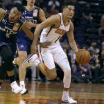 Phoenix Suns guard Devin Booker (1) advances the ball upcourt past the defense of Brisbane Bullets guard Stephen Holt (5) during the second half of an NBA basketball exhibition game Friday, Oct. 13, 2017, in Phoenix. The Suns defeated the Bullets 114-93. (AP Photo/Ralph Freso)