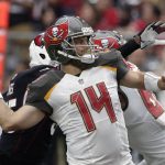 Tampa Bay Buccaneers quarterback Ryan Fitzpatrick (14) throws a pass against the Arizona Cardinals during the first half of an NFL football game Sunday, Oct. 15, 2017, in Glendale, Ariz. (AP Photo/Rick Scuteri)