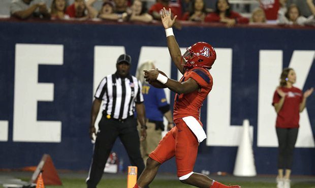 Arizona quarterback Khalil Tate scores a touchdown in the second half during an NCAA college footba...