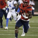 Arizona running back J.J. Taylor runs for a first down against UCLA in the first half during an NCAA college football game, Saturday, Oct. 14, 2017, in Tucson, Ariz. (AP Photo/Rick Scuteri)