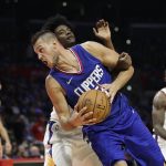Los Angeles Clippers' Danilo Gallinari, front, of Italy, is fouled by Phoenix Suns' Josh Jackson during the second half of an NBA basketball game Saturday, Oct. 21, 2017, in Los Angeles. (AP Photo/Jae C. Hong)