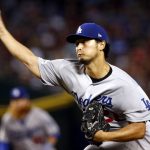 Los Angeles Dodgers starting pitcher Yu Darvish (21) throws against the Arizona Diamondbacks during the first inning of game 3 of baseball's National League Division Series, Monday, Oct. 9, 2017, in Phoenix. (AP Photo/Ross D. Franklin)