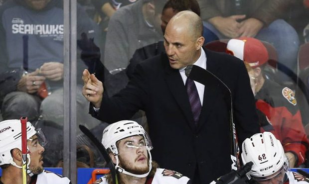 Arizona Coyotes' head coach Rick Tocchet, center, gives instruction to players during the first per...