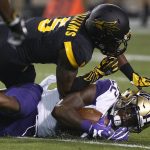 Arizona State defensive back Kobe Williams (5) tackles Washington running back Lavon Coleman (22) during the first half of an NCAA college football game, Saturday, Oct. 14, 2017, in Tempe, Ariz. (AP Photo/Ross D. Franklin)