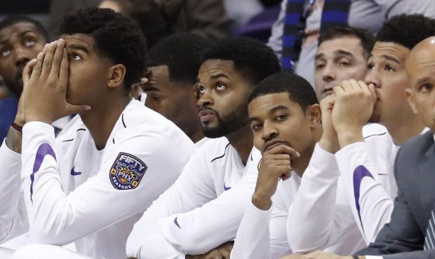 The Phoenix Suns bench watches the final seconds of an NBA basketball game against the Portland Tra...