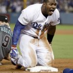 Los Angeles Dodgers' Yasiel Puig celebrates after his triple against the Arizona Diamondbacks during the seventh inning of Game 1 of a baseball National League Division Series in Los Angeles, Friday, Oct. 6, 2017. (AP Photo/Jae C. Hong)