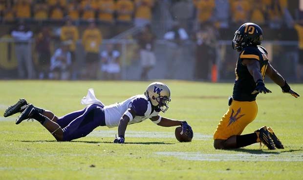 Arizona State's Kweishi Brown, right, signals an incomplete pass after he striped the ball from Was...