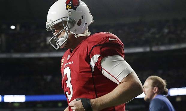 Arizona Cardinals quarterback Carson Palmer (3) leaves the field injured during the first half of a...