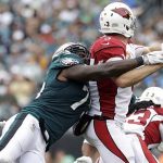 Philadelphia Eagles' Vinny Curry, left, tackles Arizona Cardinals' Carson Palmer during the first half of an NFL football game, Sunday, Oct. 8, 2017, in Philadelphia. (AP Photo/Michael Perez)