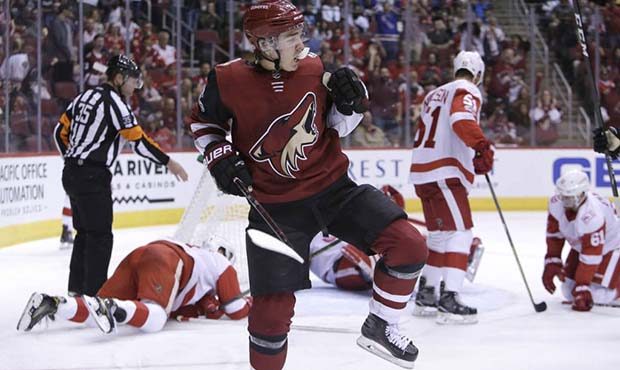 Arizona Coyotes center Clayton Keller reacts after scoring a second-period goal against the Detroit...