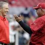 Arizona Cardinals head coach Bruce Arians, right, talks with Tampa Bay Buccaneers head coach Dirk Koetter, left, prior to an NFL football game Sunday, Oct. 15, 2017, in Glendale, Ariz. (AP Photo/Rick Scuteri)