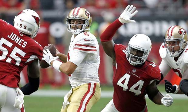 San Francisco 49ers quarterback Brian Hoyer looks to throw as Arizona Cardinals outside linebacker ...